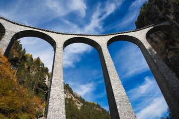 spectacular view at Train crossing Landwasser Viaduct Landwasserviadukt, Graubunden, Switzerland.