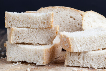sliced pieces of gray bread from second-rate flour