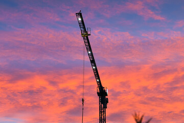 Sunrise over a construction site with amazing dramatic sky. Construction industry in 2022.