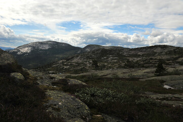Cloudy day in the mountains of Vraadal, Norway. Haegefjell mountain in the background. Horizontal photo.