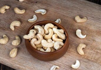dried cashew nuts on a wooden table