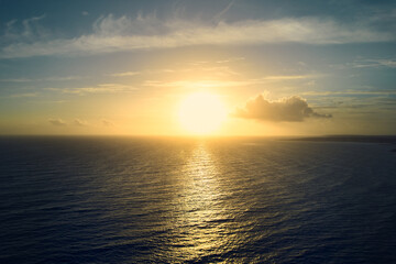 Obraz premium Sunset by the sea. Water and blue sky. Empty.