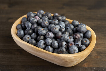 Fresh blueberries on a wooden board