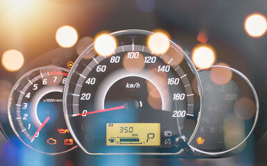 Close-up of the engine, the car's speedometer and the amount of fuel. Cheap oil concept. Hurry to...