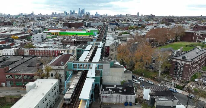 Kensington train station stop in Kensington, Northeast Philadelphia. City skyline in distance. Residential urban community.