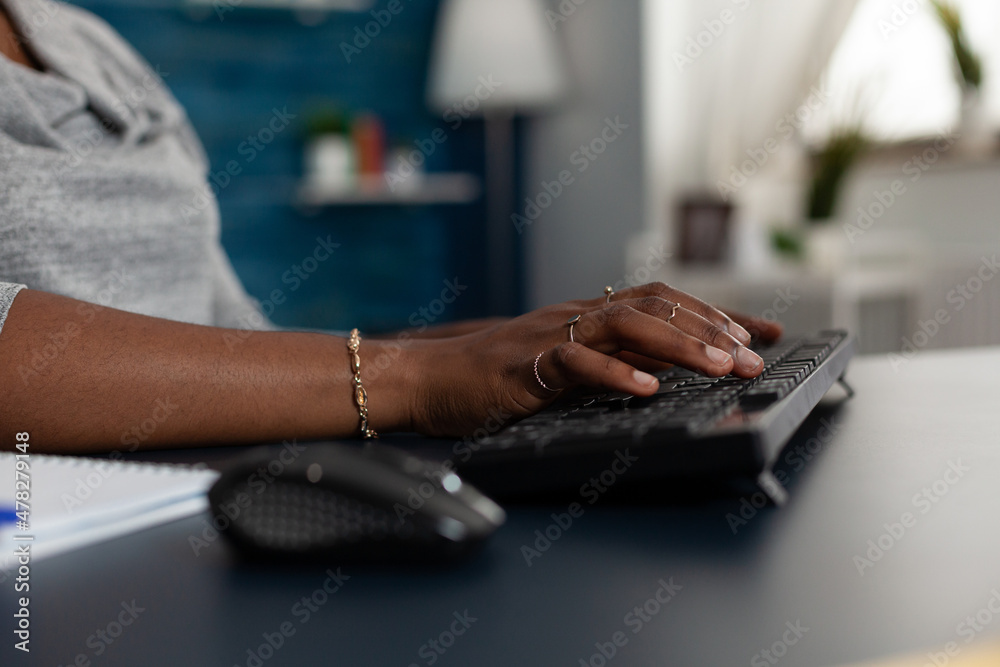 Poster close up of hands taking notes on keyboard to work on business project at home office. employee work