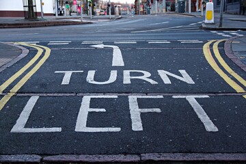 UK Road white markings Turn Left with the arrow showing the direction
