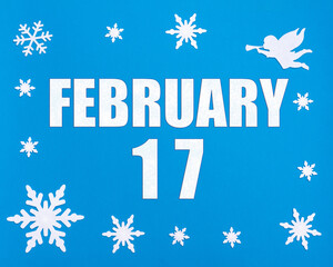 February 17th. Winter blue background with snowflakes, angel and a calendar date. Day 17 of month.