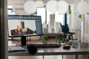 Closeup of modern architect desk with workstation showing 3d blueprints of architectural building complex. Desktop screen showing model of urban planning architecture construction plan.