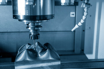 The mold and die manufacturing process by CNC milling machine with ball end mill tool.