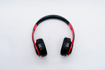 Earphones that are red black on a white background
