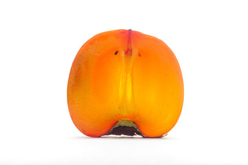 Fresh, ripe persimmon fruit cut on two isolated on white background. Half of date plum close up. Persimmon pulp texture
