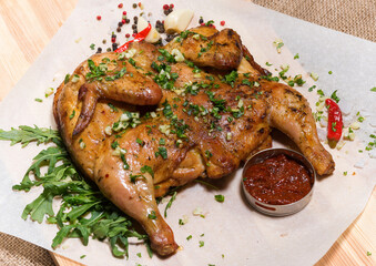 Grilled chicken with herbs and sauce..