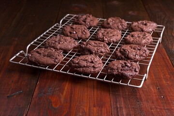 Triple chocolate chip cookies on a cooking rack