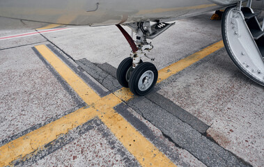 Turboprop aircraft parked on the runway at daytime