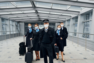 Airplane crew in uniform is going to the work together