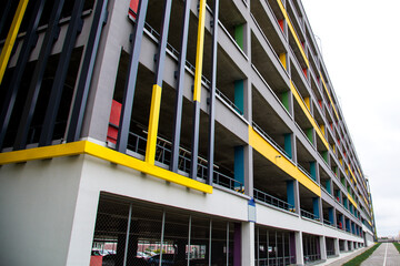 Parking in the city. Parking lot in the form of a new modern building, painted in bright colors
