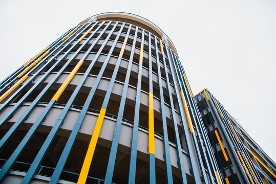 Parking in the city. Parking lot in the form of a new modern building, painted in bright colors