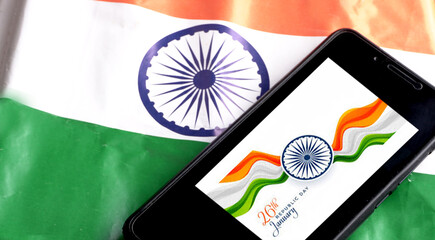 Mobile phone on the Indian flag, Concept for Indian Independence day and Republic day. A place for text on screen