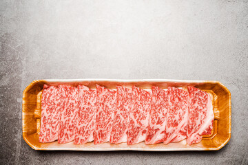 Premium Rare Slices sirloin Wagyu A5 beef with high-marbling texture on food tray served for...