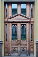 wooden door with a beautiful decorative finish in the historical part of the Russian city of Kazan