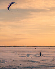 Parasailing on the frozen ocean in the evening