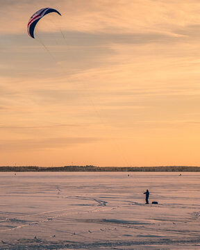 Parasailing on the frozen ocean in the evening