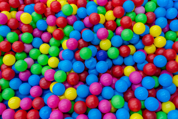 Fototapeta na wymiar A lot of colorful plastic balls in ball pool