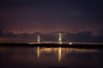 The Great Belt Bridge illuminated at night