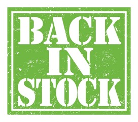 BACK IN STOCK, text written on green stamp sign