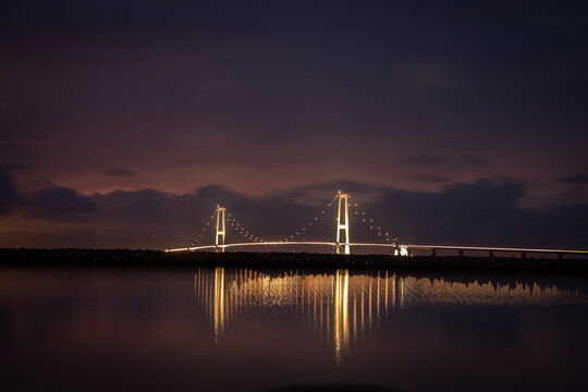 The Great Belt Bridge illuminated at night