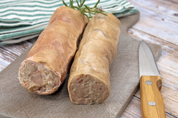 raw andouillettes de Troyes on a cutting board
