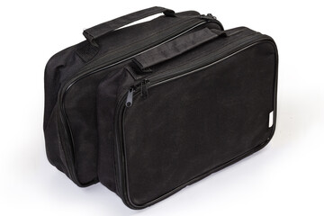 Naklejka premium Small flat black textile bags with handles on white background