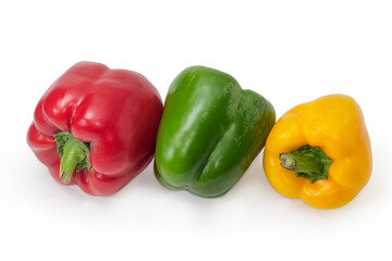 Three bell peppers different colors on a white background