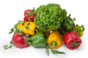 Bell peppers different colors and various greens on white background