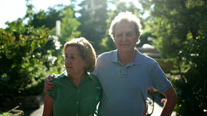 Senior couple standing outside together, 60s husband and wife