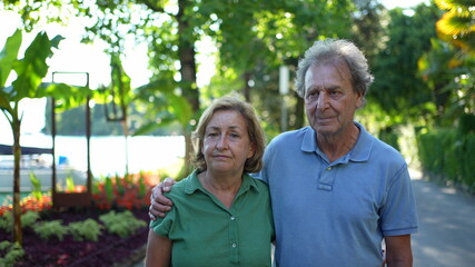 Fototapeta premium Senior couple standing outside together, 60s husband and wife