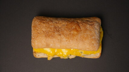 Delicious sandwich on a black background.