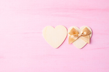 Two heart shape with ribbon on pink background, Valentine day concept