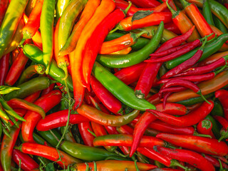 Sale of hot pepper on the market. Red and green pepper. Healthy ripe hot pepper with lots of vitamins and nutrients.