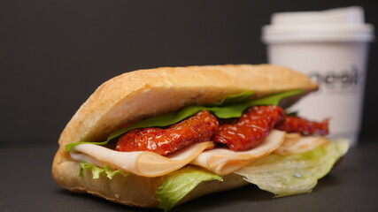 Delicious sandwich on a black background.