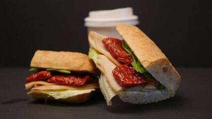 Delicious sandwich on a black background.