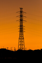 Fototapeta premium Silhouette of high voltage transmission tower