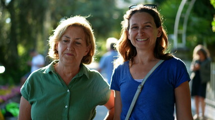 Mother and daughter together outside