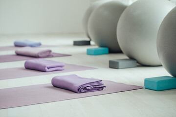 Yoga mats and balls. Yoga accessories, hall, room. High quality photo