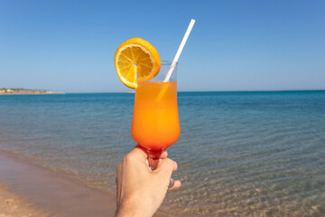 Iced mocktails glass on the beach. Cocktail on beach.