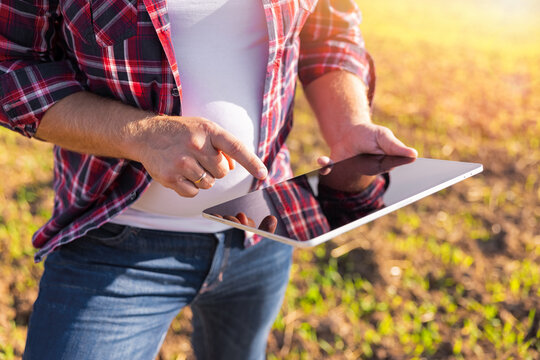 Male farmer using modern tech for smart farming