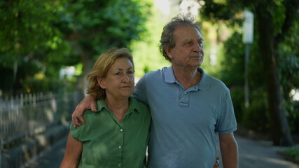 Happy senior couple walking together in afternoon walk