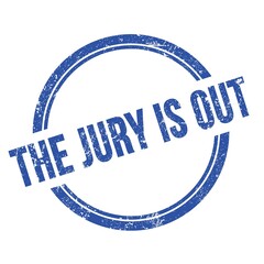 THE JURY IS OUT text written on blue grungy round stamp.