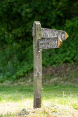 old wooden direction sign in the Devon countryside